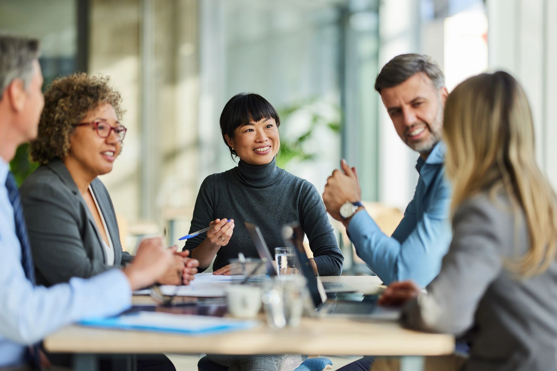Professional business team member smiling during office meeting