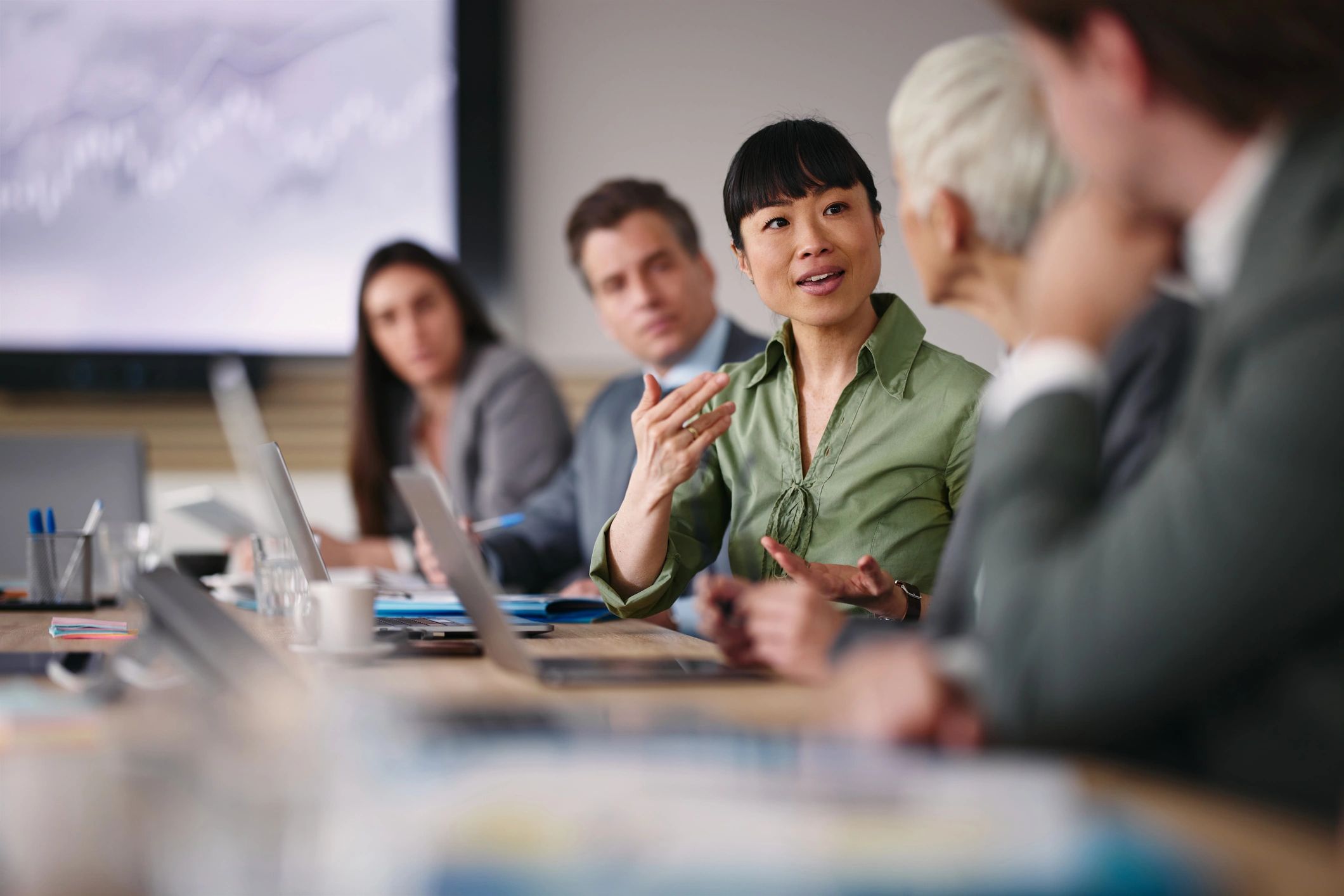 Business professionals discussing work during an office meeting